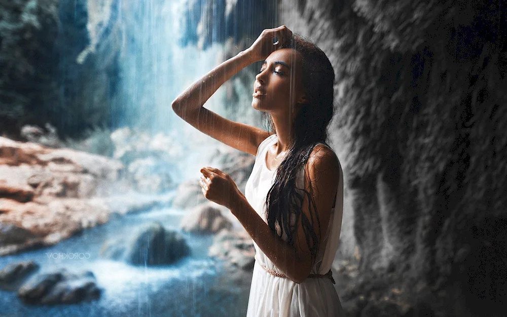 Alina Astrovskaya under a waterfall