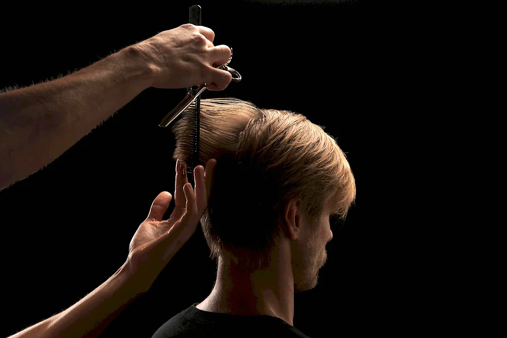 Barber shop stylist Alex Zinchenko