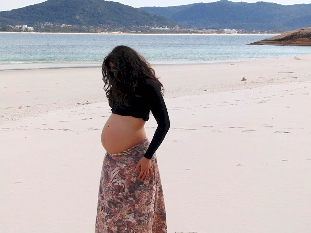 Pregnant girl at the beach