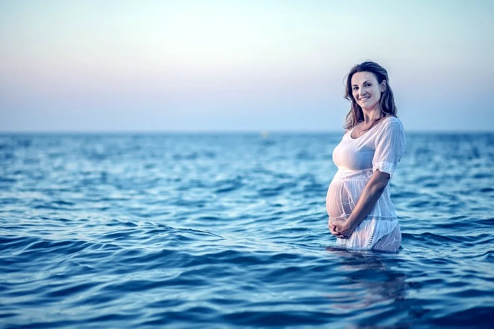 Pregnant women on the beach