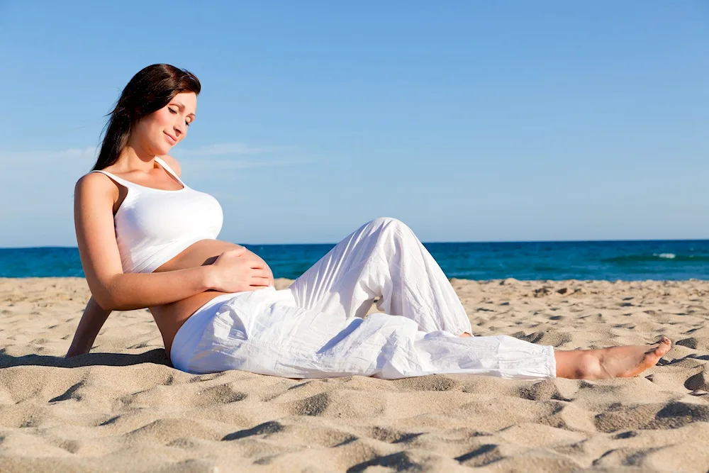 Pregnant women at the beach