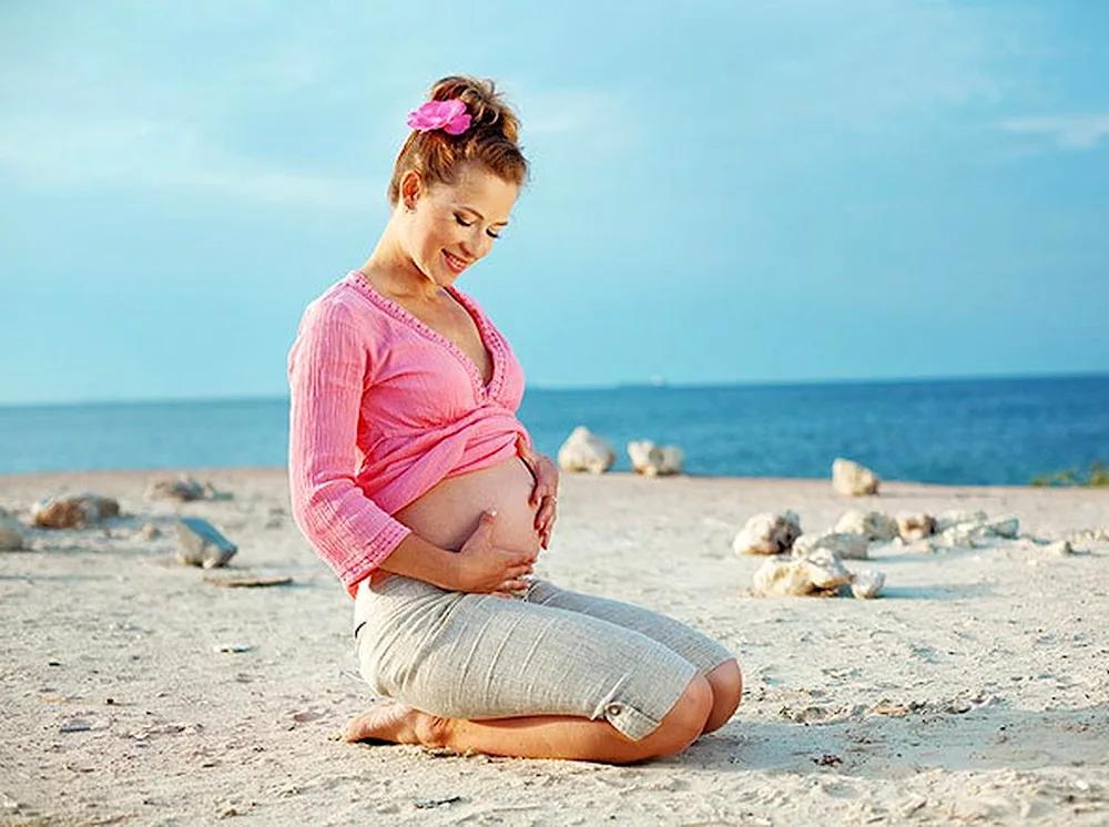 Pregnant girl on the sea Sea