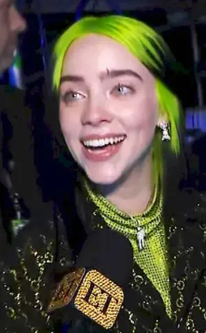 Billie lish with green hair smiles