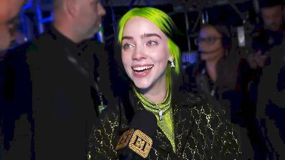 Billie lish with green hair smiles