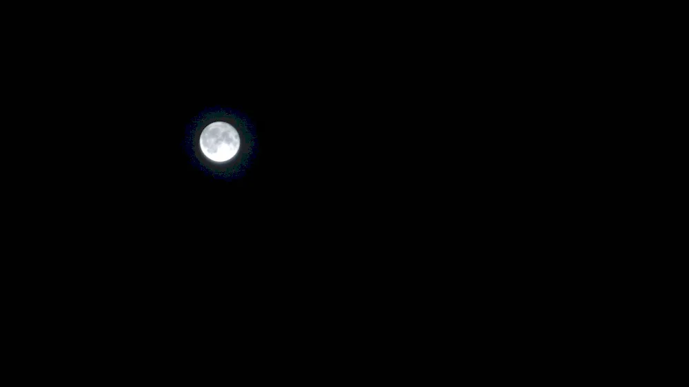 Blicks of the moon on black background