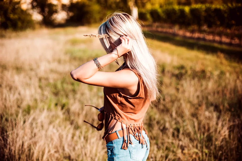 Blonde in the nature from the back