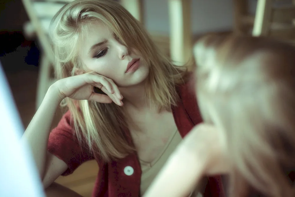 Blonde reflection in the mirror