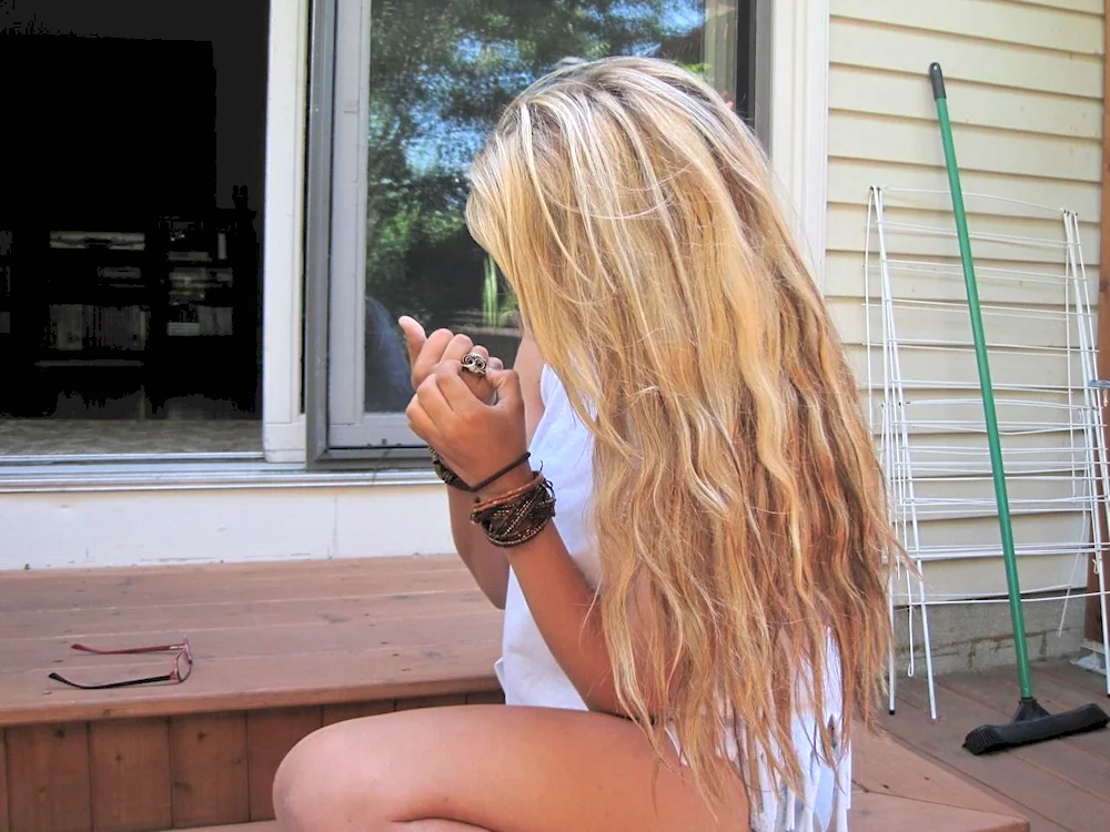 Blonde in the mountains from back