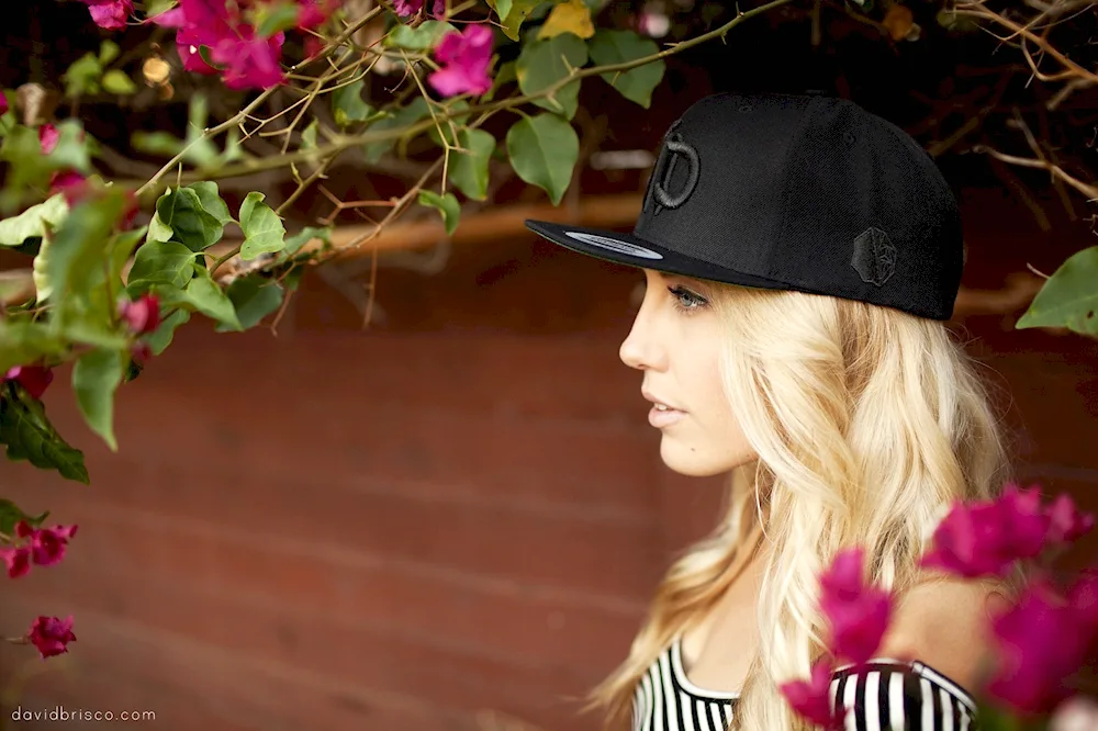Blonde girl. in a baseball cap