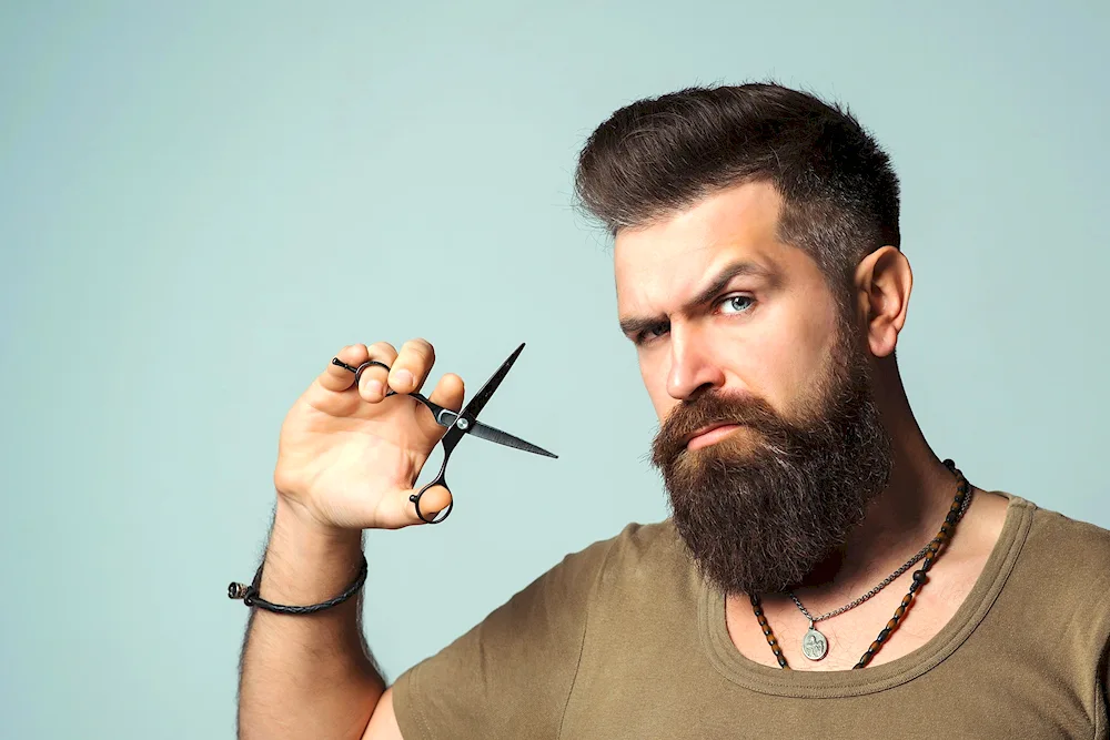 A bearded man and scissors