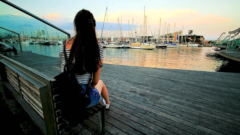 Brunette with long hair at the sea