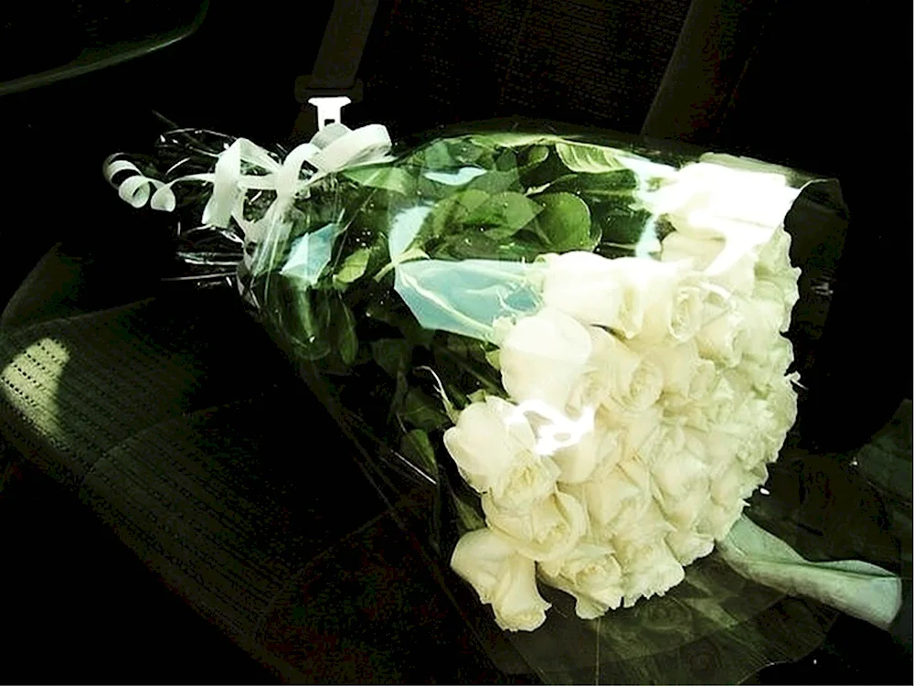 Beautiful bouquet of flowers in the car