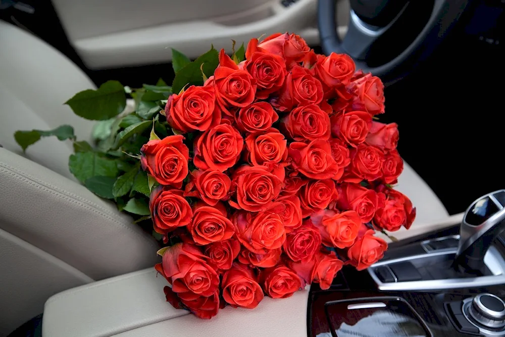 A bouquet of roses in the car