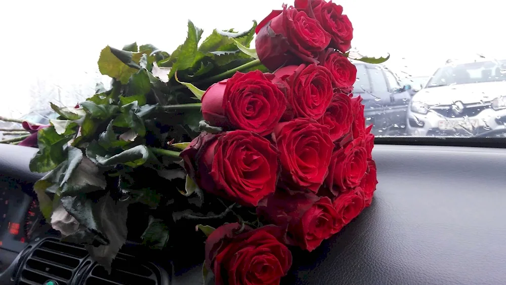 A bouquet of flowers in the car