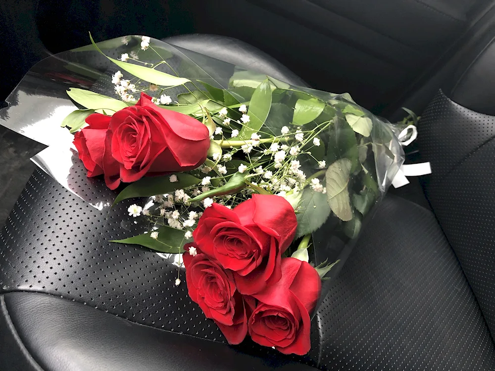 A bouquet of flowers in the car