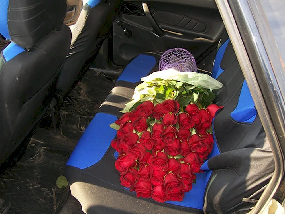 Bouquet of flowers in the car in the interior of the car