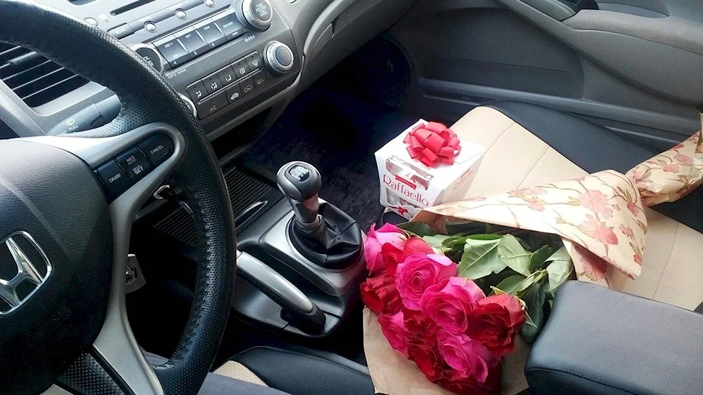 A bouquet of roses in the car