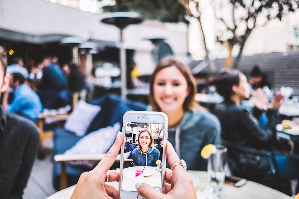 A man taking photos on his phone