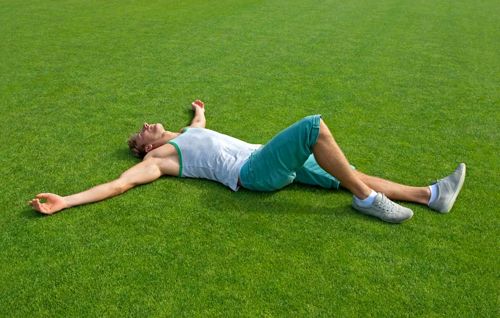 A man lying on the grass