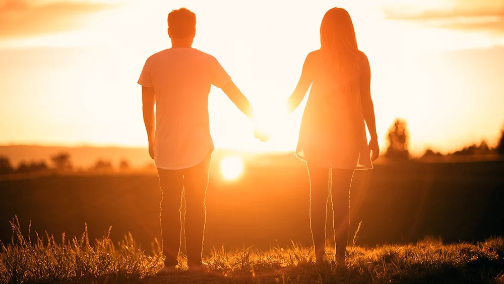 Man against sunrise background