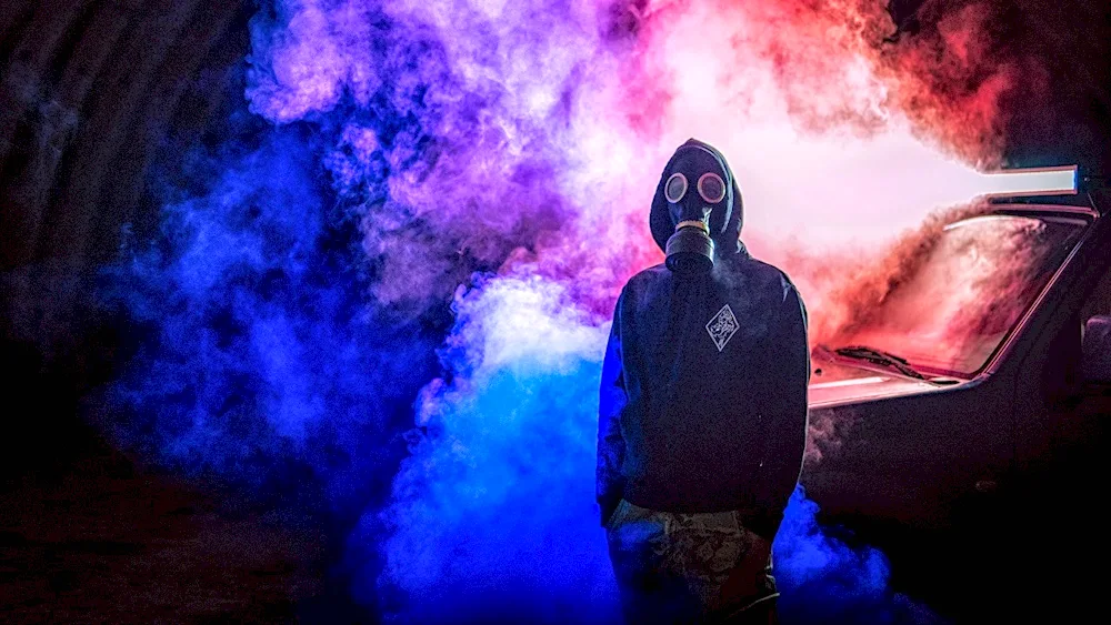 Man in gas mask in smoke