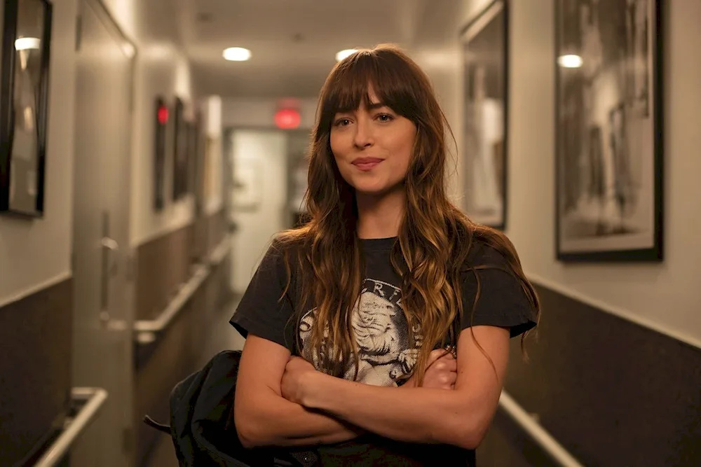 Dakota Johnson. Johnson in a pink dress