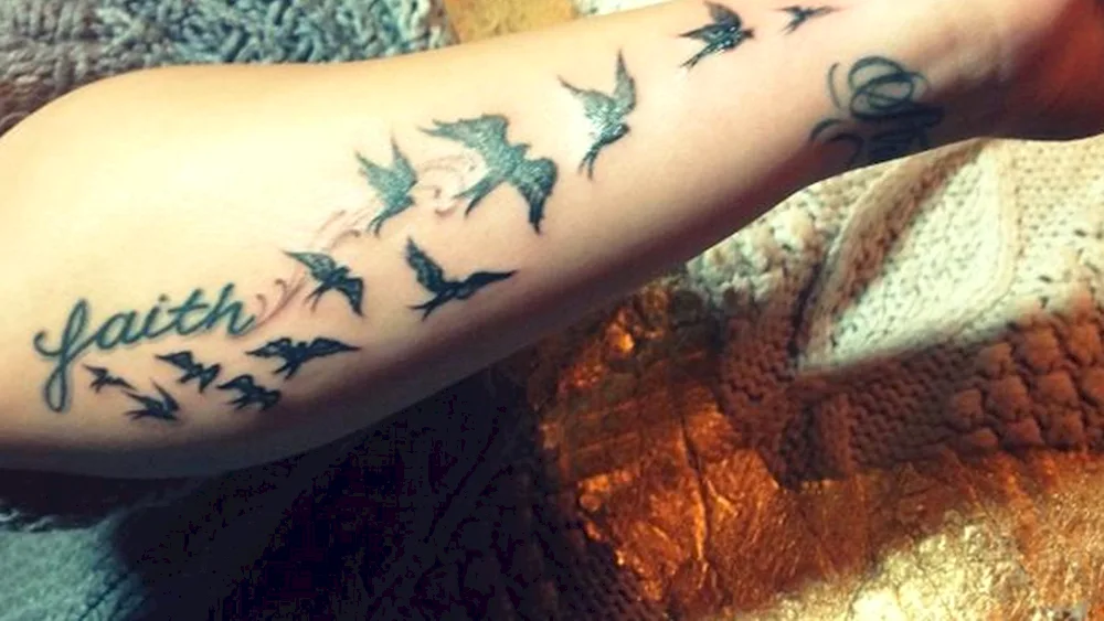 Demy Lovato bird tattoo