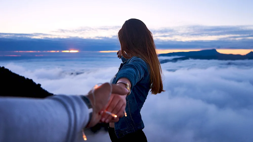 Girl holding girl's hand