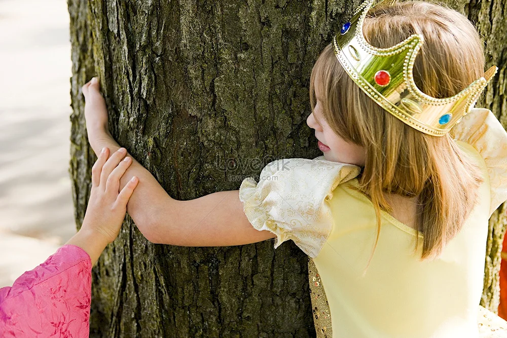 The girl is wearing a crown