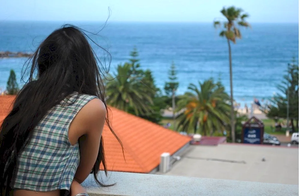 Brunette girl with long hair from behind