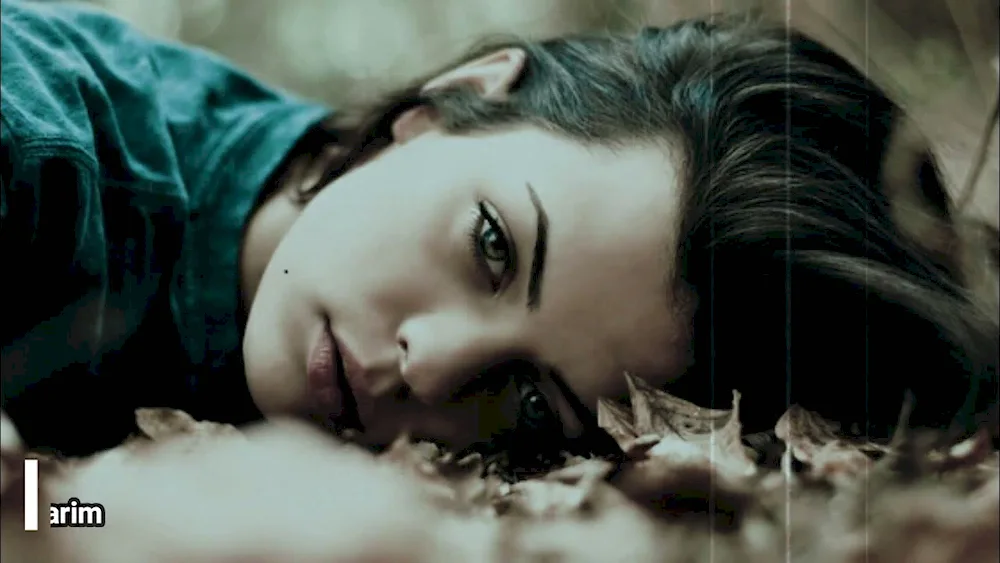 Girl lying in the woods