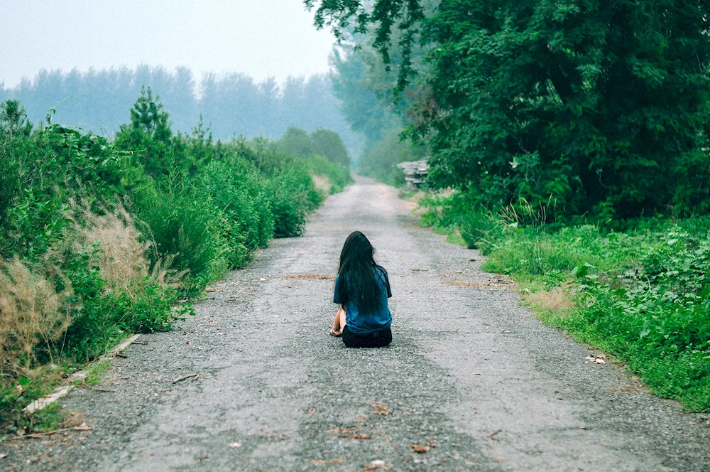 Girl on the road from the back