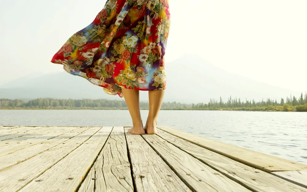 Girl in a dress with plume