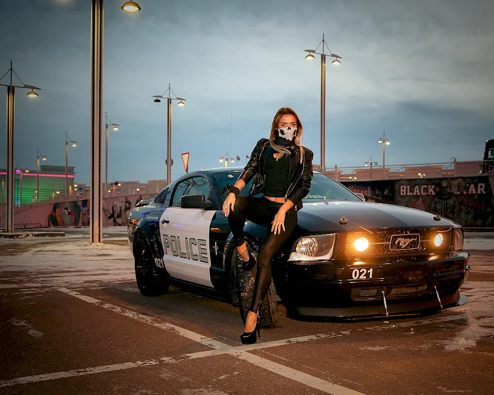 Girl in a police car