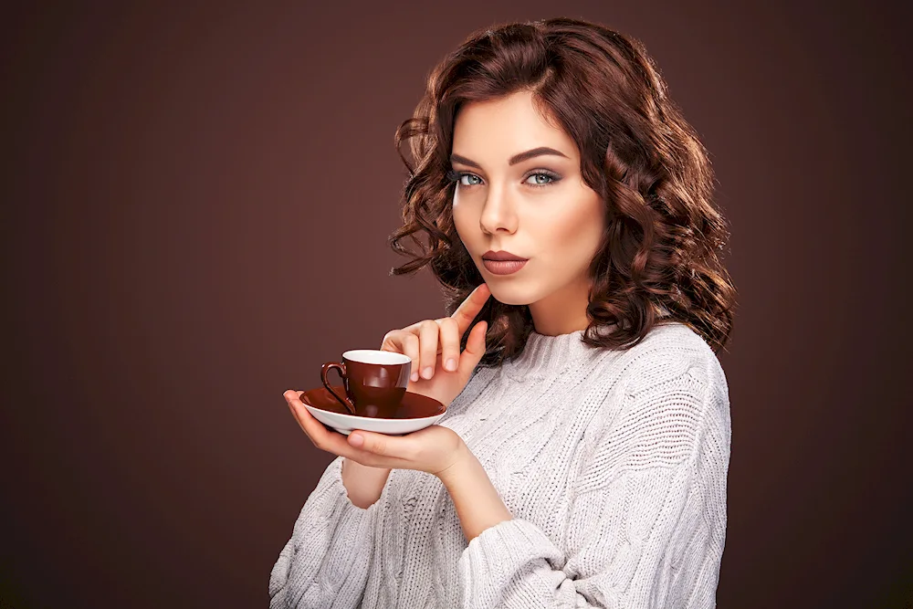 Girl with coffee in paper cup