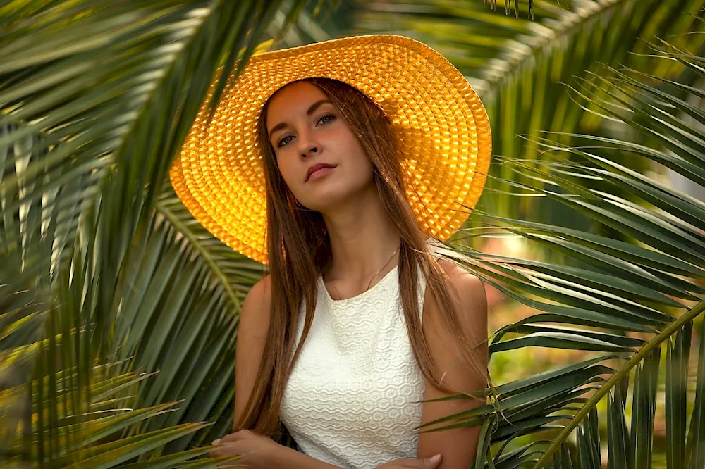 Girl under palm tree