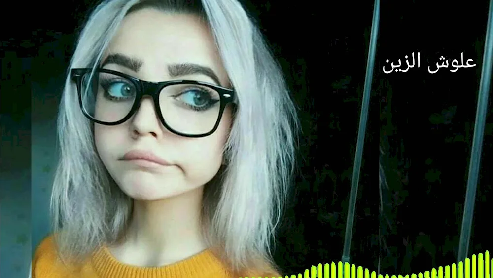 Girl with white hair in glasses