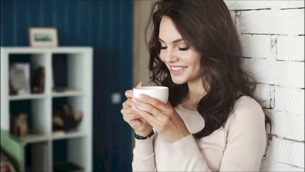 Girl with cup of tea coffee