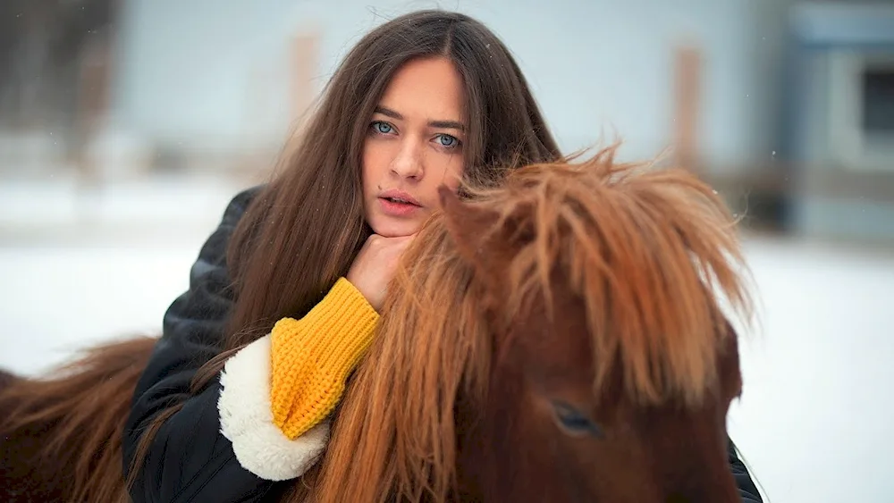 Girl with long hair on horseback
