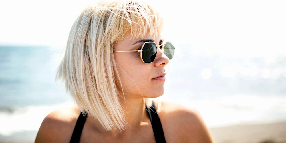 Blonde with short hair at the sea