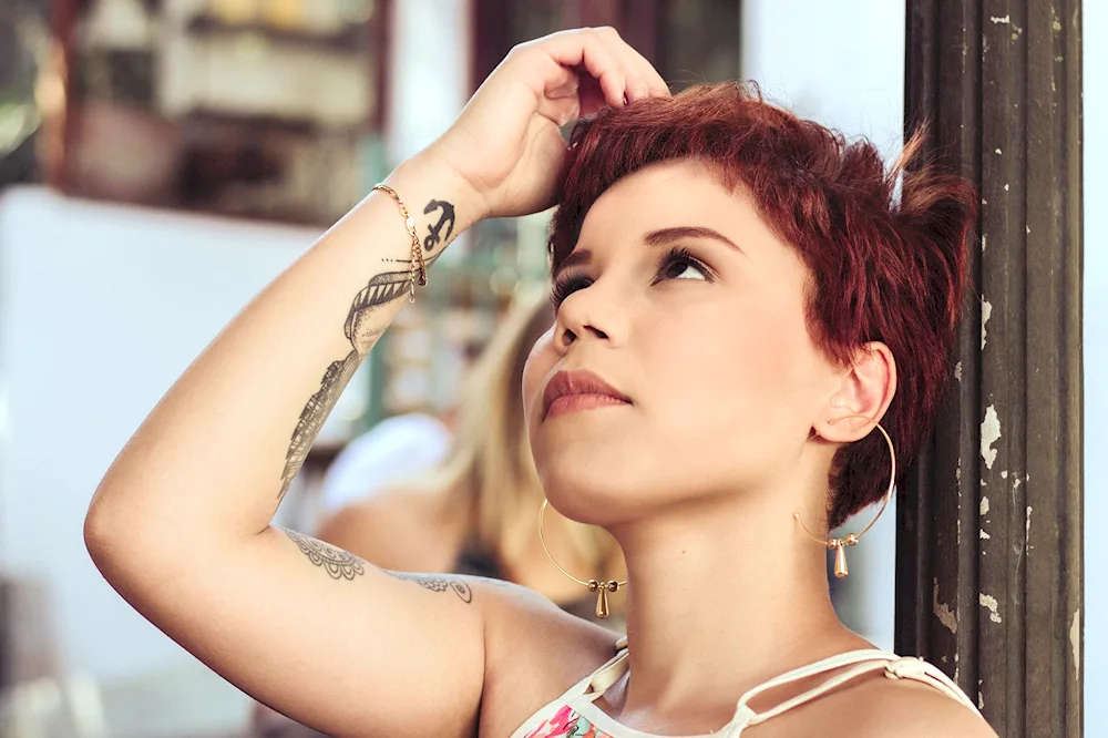 Girl with short haircut and tattoo