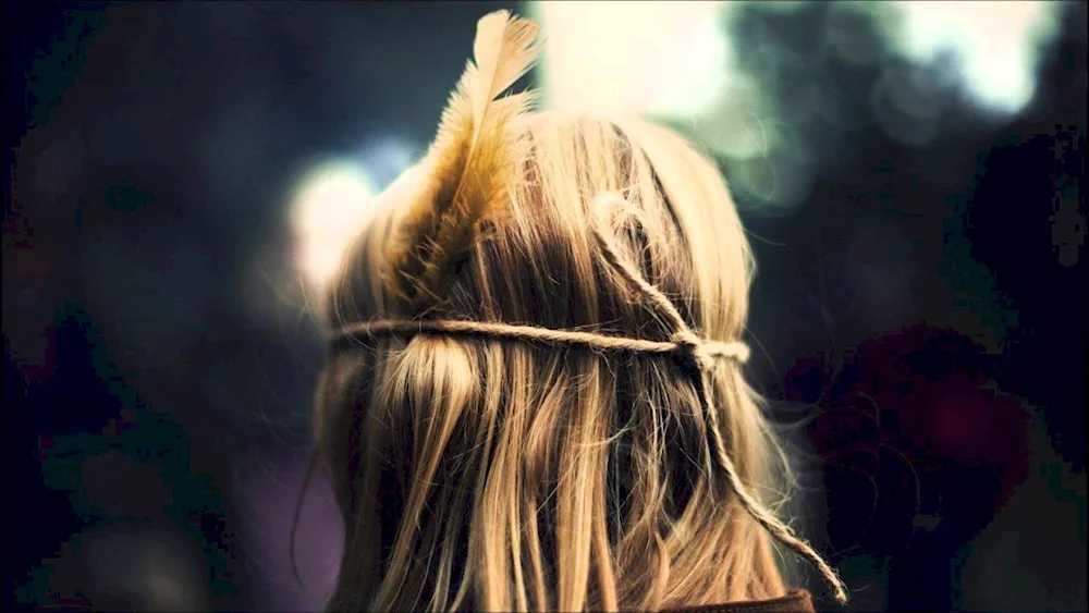 Girl with feathers in her hair