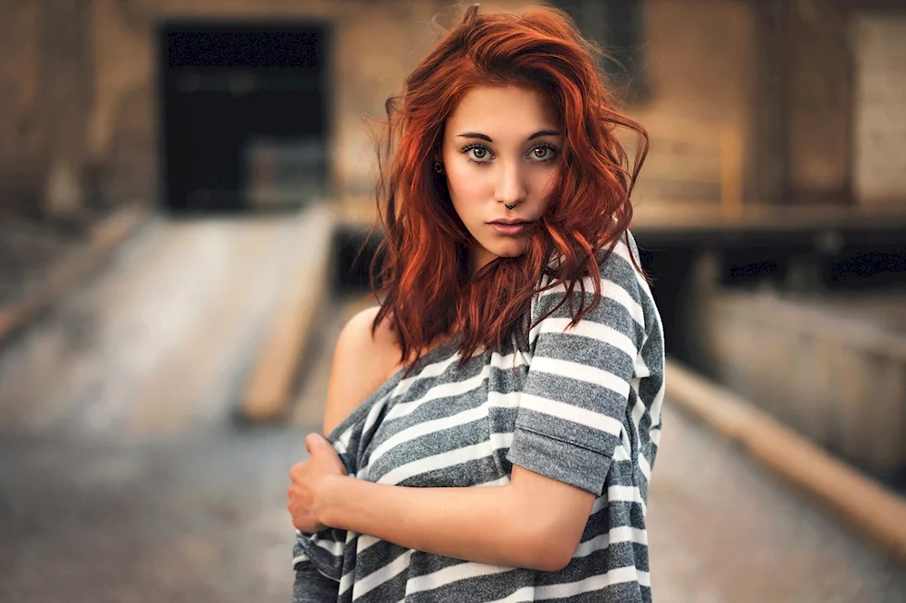 Girl with red hair on dark browns