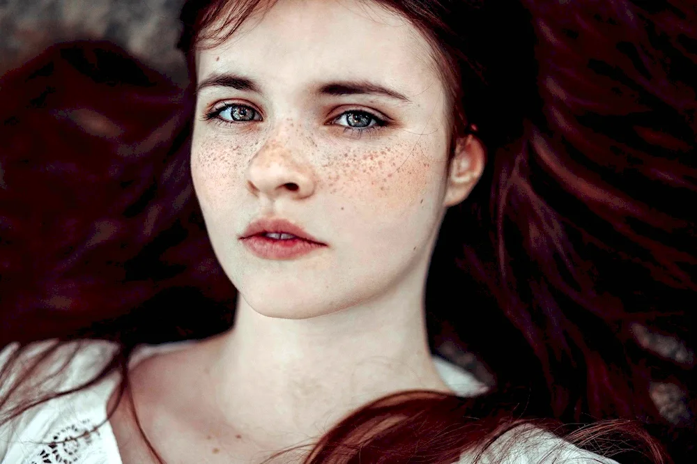 Girl with blue eyes and freckles