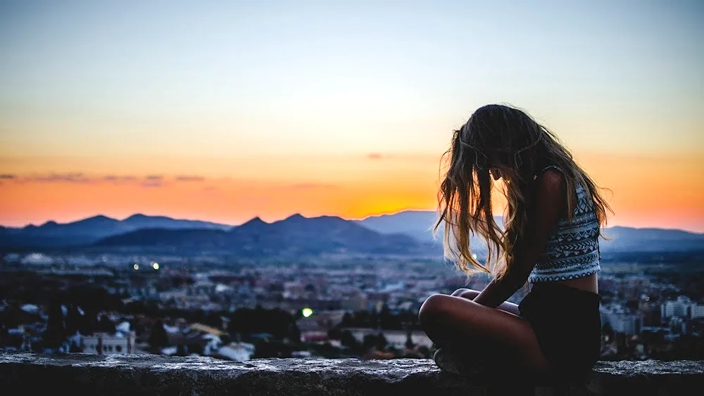 Girl on the background of skyscrapers