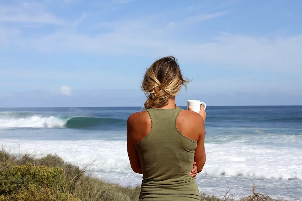 Girl by the sea from the back