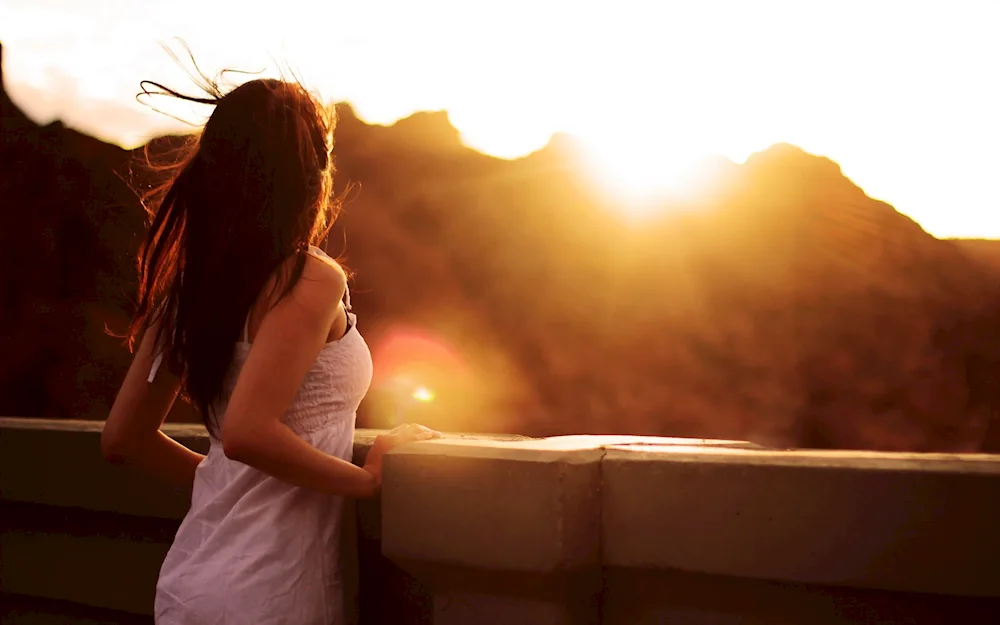 Girl with long hair by the sea