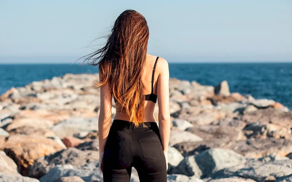 Girl with curly hair from back