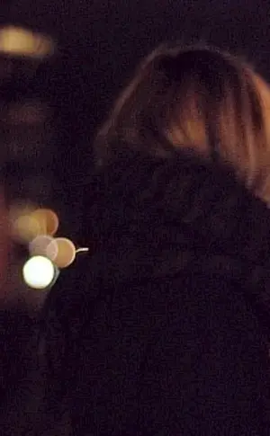 Girl with a back in winter night