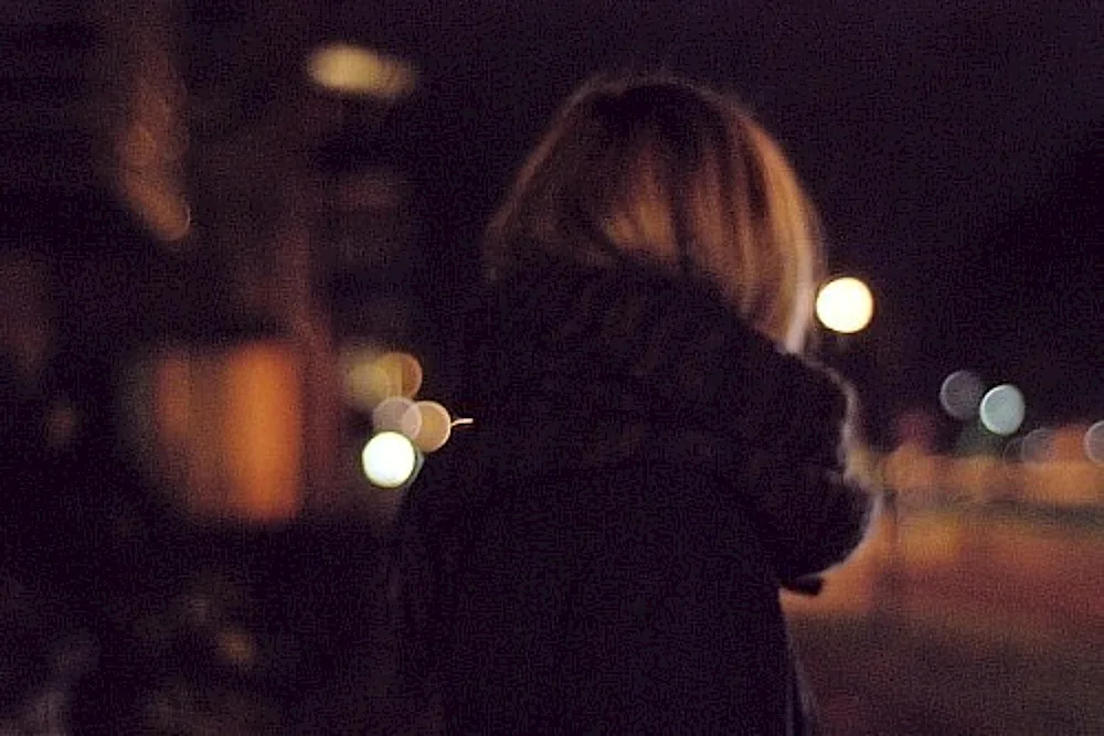 Girl with a back in winter night